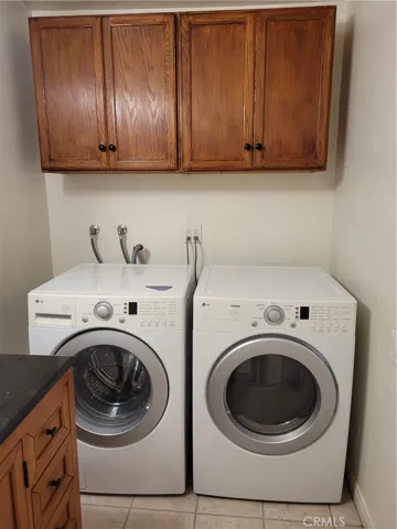side by side washer and dryer with built in cabinets