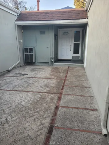 Gated Entry to attached Carport/Patio