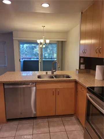 Upgraded and updated Kitchen with corrian counter tops, stainless appliances, dishwasher, garbage disposal