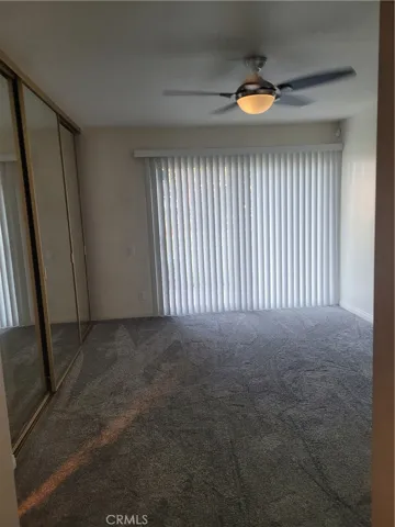 Main bedroom, great size, newly installed carpet floors, ceiling fans/lights, vertical blinds, French sliding doors to backyard deck.