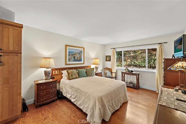 Sizeable main floor primary bedroom with attached bath and walk-in closet