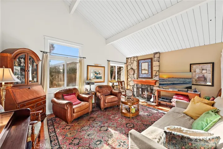 Light and bright spacious living room with high ceilings and gas fireplace