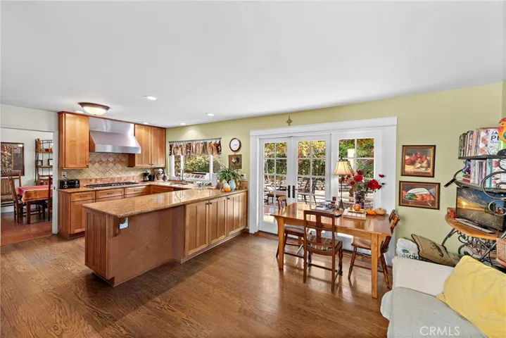 Remodeled kitchen with den area. Double french doors to yard.