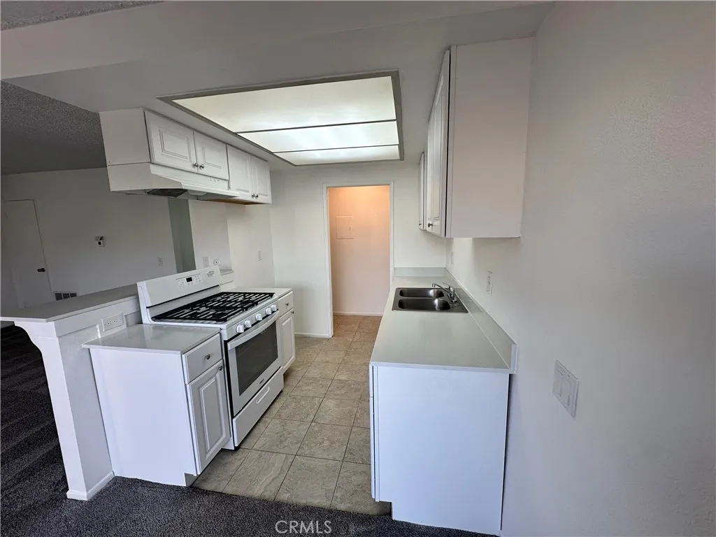 Full view of the kitchen to the laundry area
