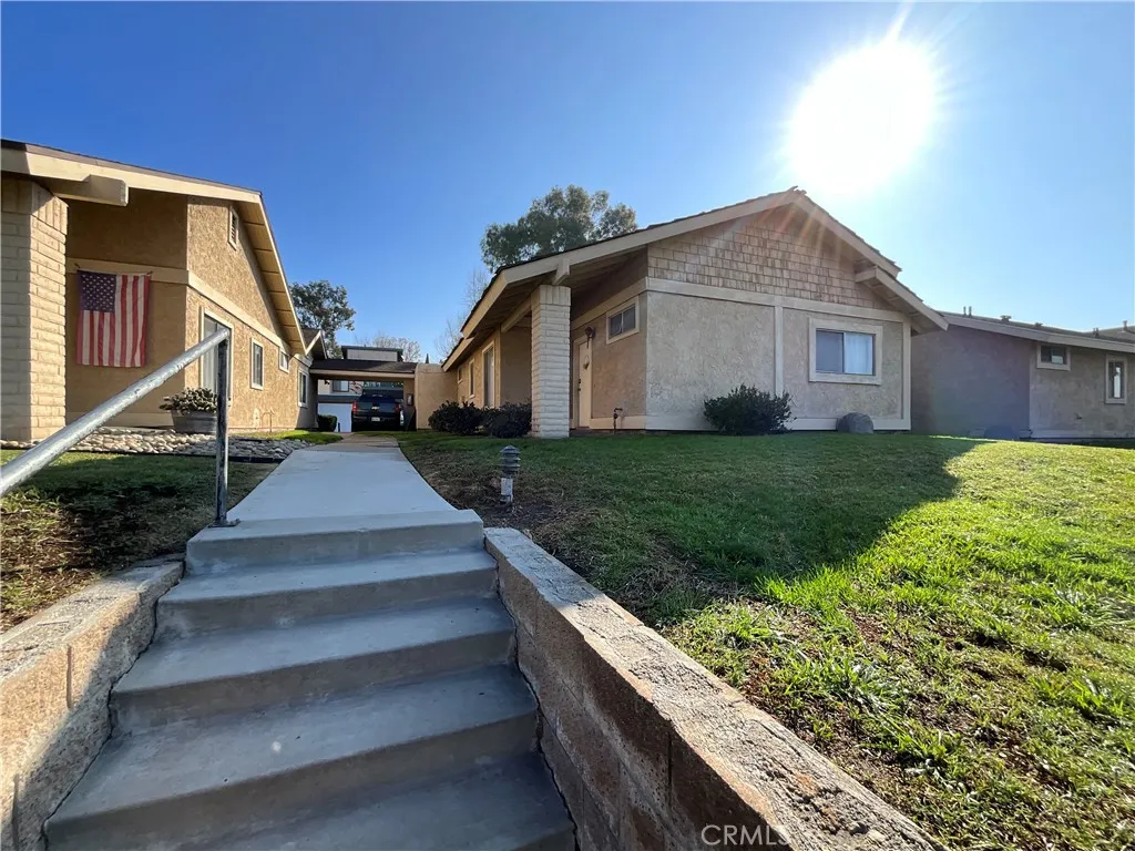 Third unit on the property of 1404 has two bedrooms, two baths, central air/heat with a one car garage and private patio.
