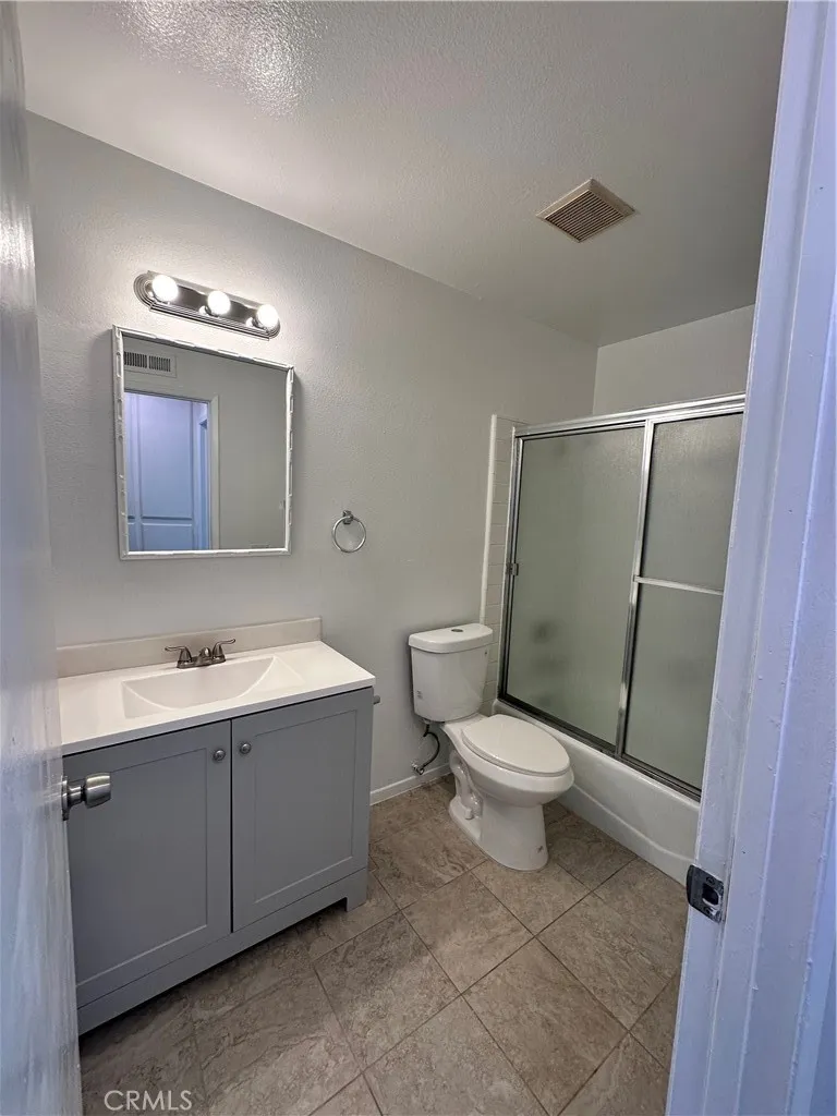 Bathroom area for the one bedroom, shower and tub.