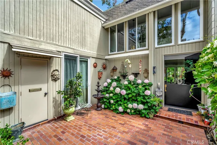 Private front courtyard with walk in storage closet.