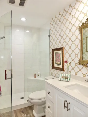 First floor remodeled 3/4 bath with marble shower and quartz counter top.