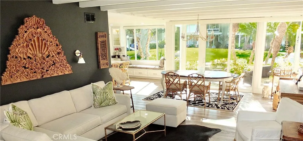 Living room view to tree landscaped lawn.