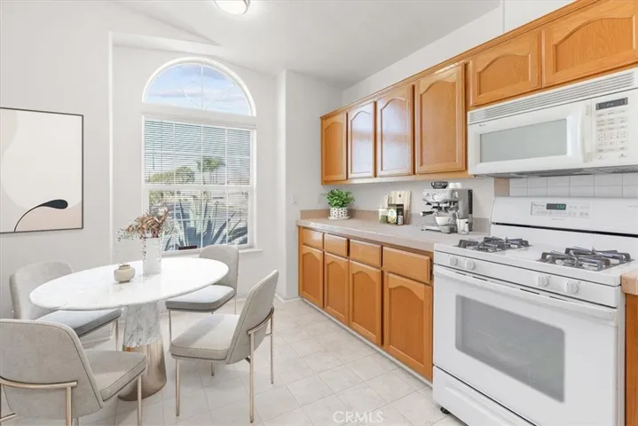 Kitchen photos enhanced and online staged. (New paint & Flooring)