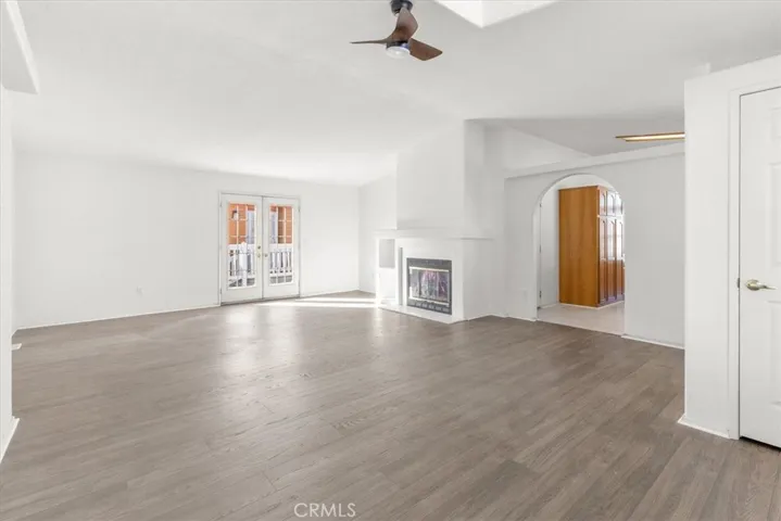 Living Room/Dinning room (New paint & Flooring)  Fireplace. Un staged