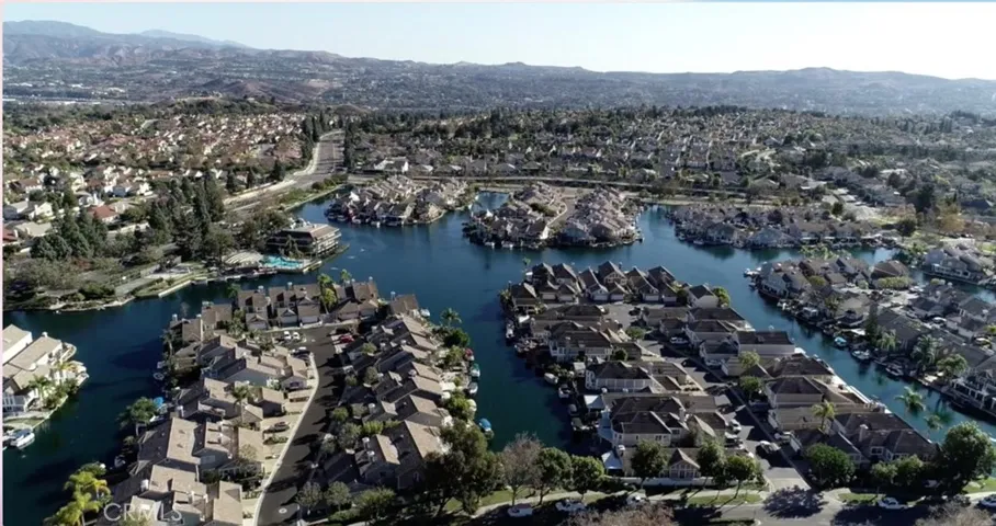 East Lake with homes on the shores, club house, family pool, adult pool, kiddie pool, fishing, basketball and volley ball courts, barbecue area, and Duffy boating access.