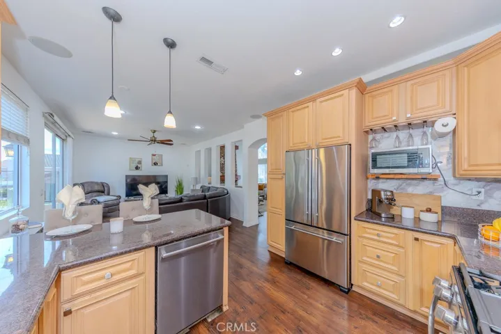 View of the kitchen connecting to the spacious family room.