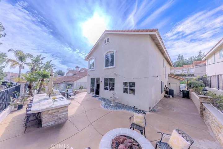 Southwest view of the backyard and north side yard with garage access.