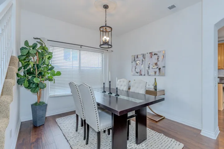 Dining room with a chic dining room fixture.
