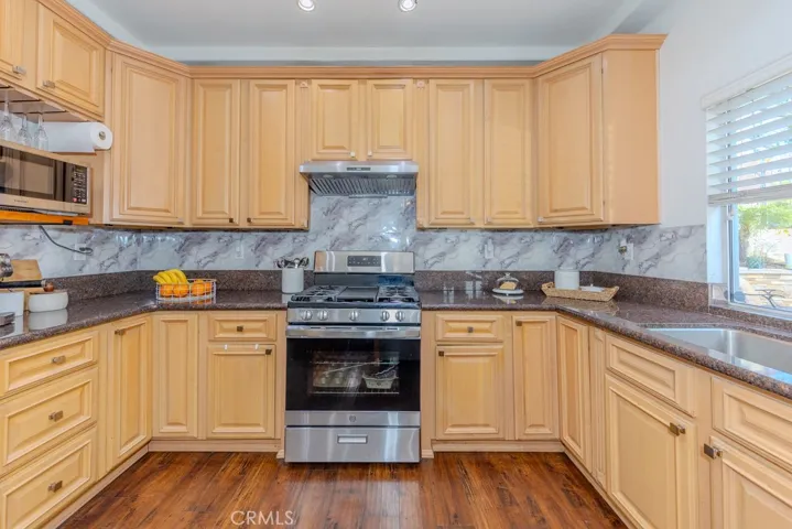 View of the kitchen with stainless steel​​‌​​​​‌​​‌‌​​‌​​​‌‌​​​‌​​‌‌​​‌‌​​‌‌​​​​ appliances.
