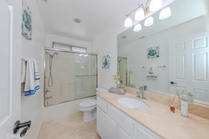 Upstairs bathroom with tub shower.