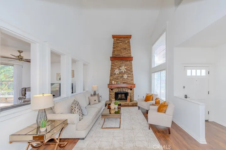 Spacious living room with a beautiful stone fireplace.