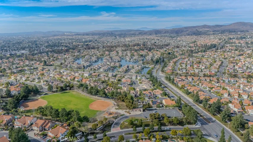 Overhead view of East Lake Village and Village Center Drive looking north featuring Shapell Park, the shores at East Lake, and some of the 2200 homes in East Lake Village where the HOA is $117/month.