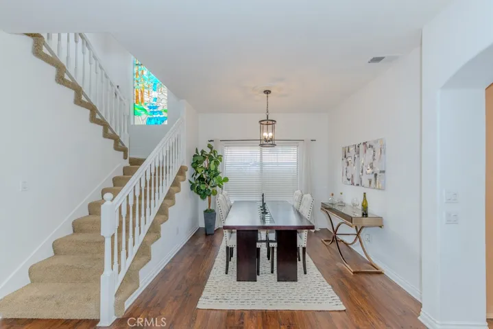 View of the dining room and the stairway leading to the three upstair bedrooms.
