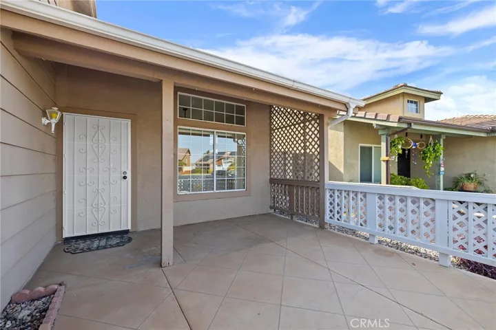 Fenced in and covered front porch