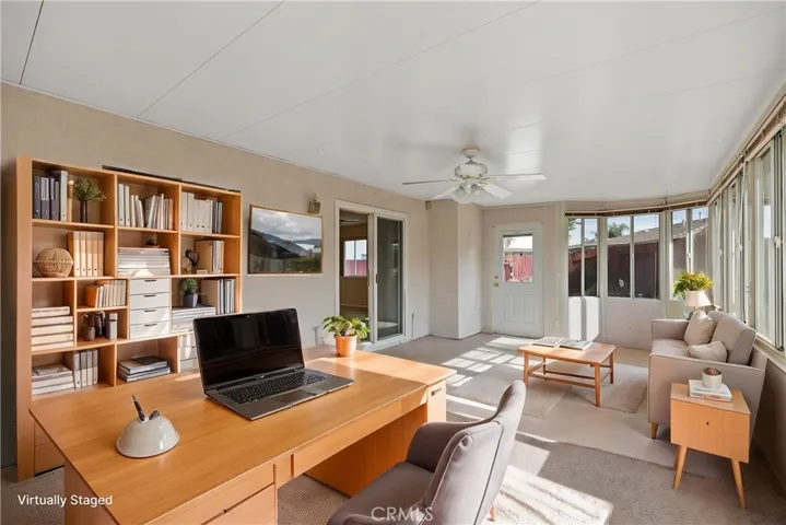 Enclosed Patio/sunroom virtually staged as a home office