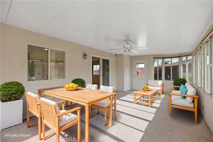 Enclosed Patio/sunroom virtually staged as an outdoor space