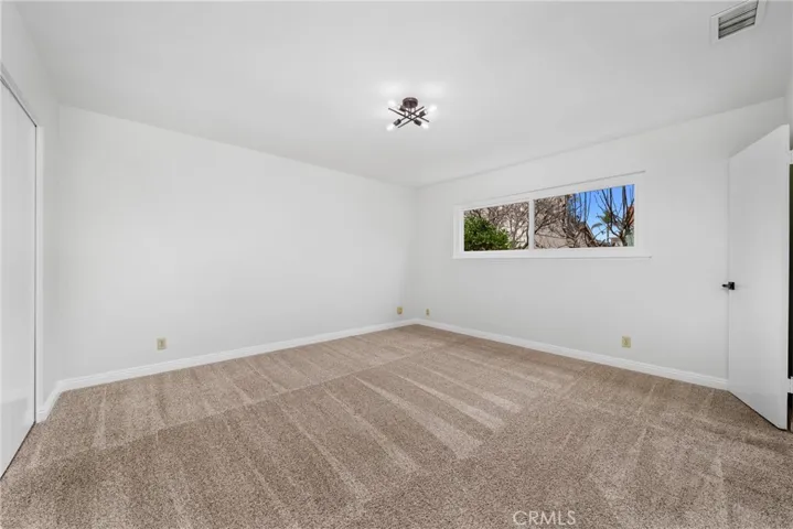 The spacious DOWNSTAIRS owner’s suite!