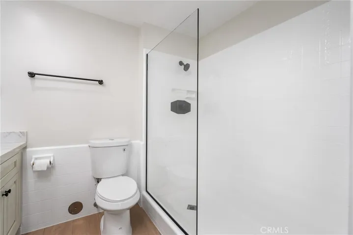 Updated step-in tile shower with new glass enclosure!