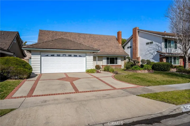Featuring inlaid brick drive and walkways.