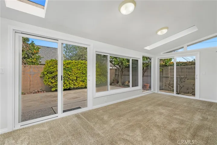 Open to the kitchen and dining area is a sunroom!