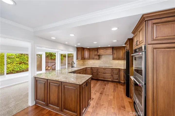 Custom maple wood self-closing cabinets.