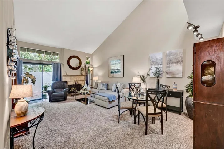 Large living room with high ceilings and new carpet