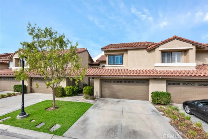Attached two car garage with full side driveway