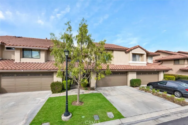 Attached two car garage with full side driveway