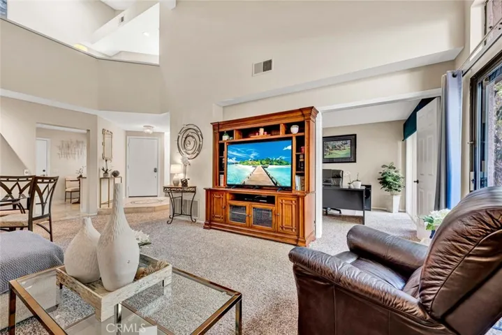 Living room open to private enclosed patio