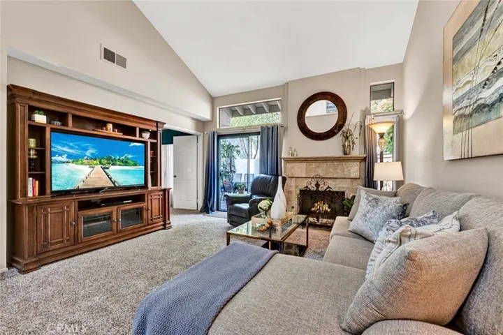 Living room open to private enclosed patio