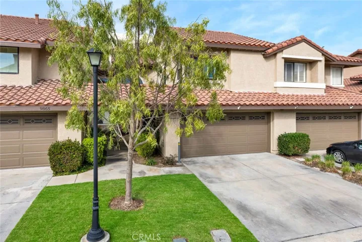 Attached two car garage with full side driveway