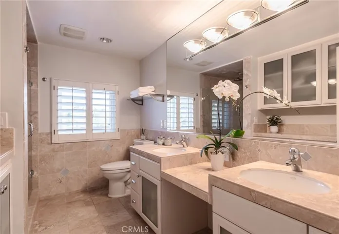 Primary bathroom with dual sinks and make-up counter