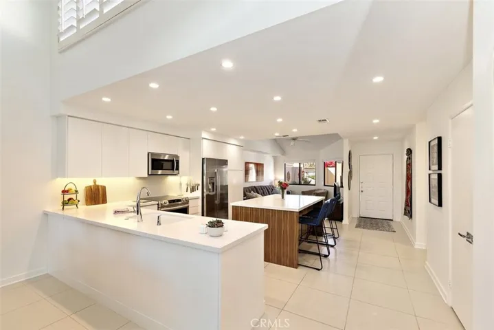 From the Living Room into Kitchen and Den in background