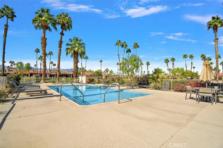 Nearby Pool with full sun exposure. Umbrellas provided