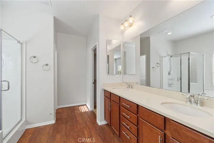 Primary bath with dual vanity and walk-in closet