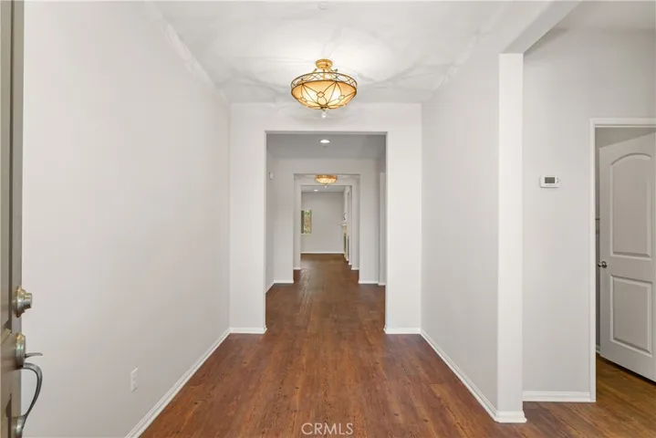You'll be greeted by this elegant entry hallway. So many options for decorating and useful space.