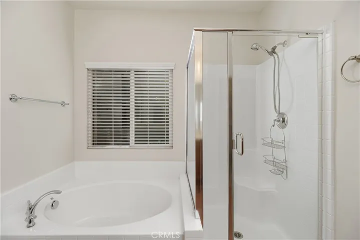 Primary bathroom with separate tub and shower