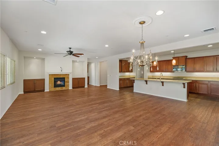 Nonstaged great room with dining and kitchen