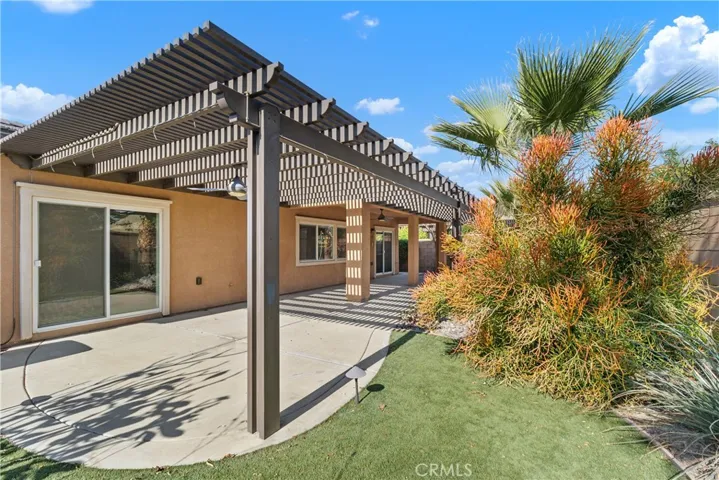You'll appreciate this large patio cover with ceiling fans