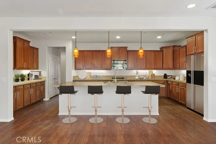 Kitchen with an abundance of cabinets and counter space. Large Pantry area, stainless appliances. Virtually Staged