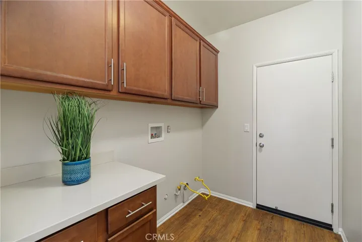 Laundry with storage and folding area.