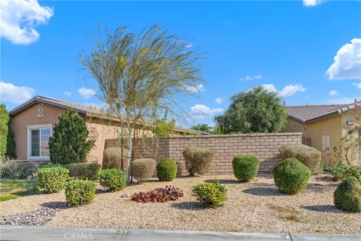 Front yard with grass and low maintenance landscaping