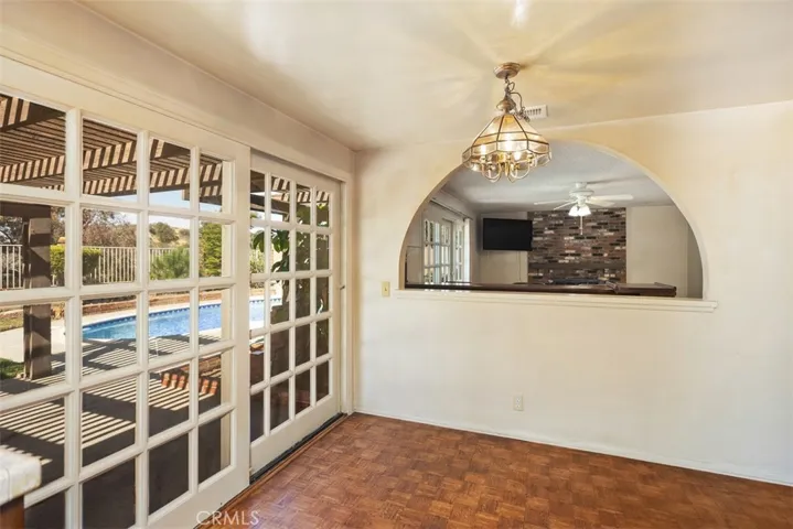 Expansive living room/dining room with cathedral ceilings could be opened up into kitchen/family room creating even more expansive open concept living.